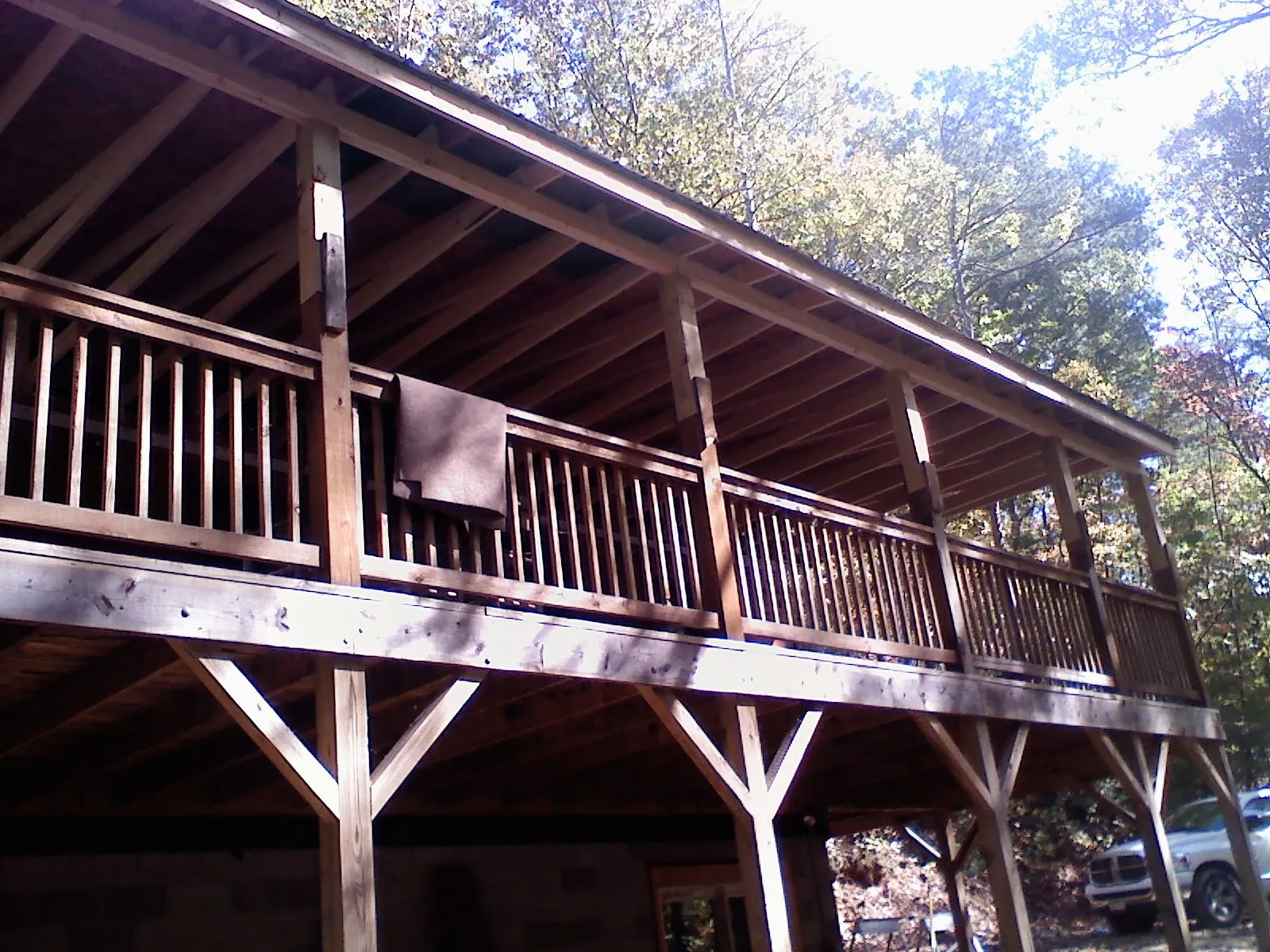 Timber framing under a new elevated porch and deck — Roof Leak Repair in Uxbridge by Roofing Brothers